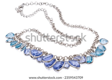 Old necklaces made from silver isolated on  white background,decolate by blue and purple artificial diamond ,macro photo,has path   
 