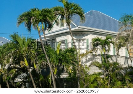 Old neoclassic victorian house with tropical backyard, architecture in Key West, Florida