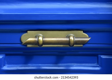 Old Neoclassical house cobalt blue wooden door with an antique brass handle in Nafplio, Greece. - Shutterstock ID 2134542393