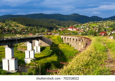 Old and new railway bridges, old viaduct Vorohta, Ukraine. Carpathian Mountains, wild mountain landscape - Shutterstock ID 702318022