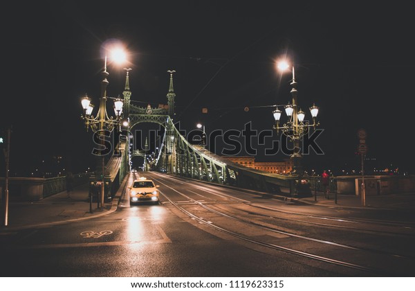 old night bridge and empty\
street urban city scape concept with noise pollution and lantern\
glares
