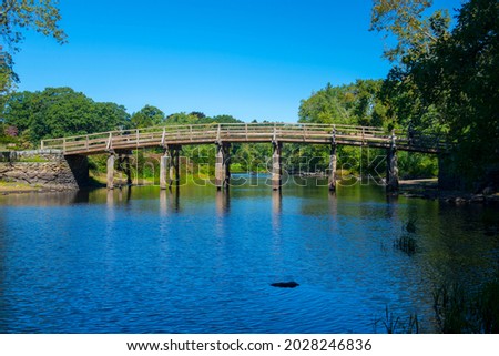 Old North Bridge and Memorial obelisk in Minute Man National Historical Park, Concord, Massachusetts MA, USA.