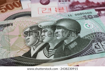 Old North Korean Korea Won currency banknote - military expenditure armament war economy concept 