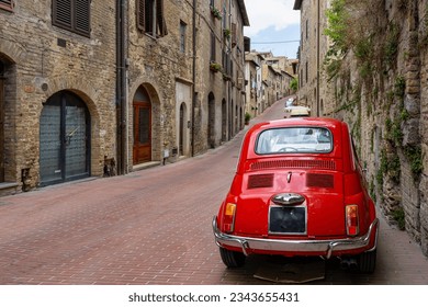 old nostalgia red car in the italy street, tuscany - Powered by Shutterstock