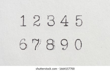 Old numbers by typewriter. Vintage font on white paper
