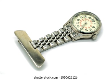 An Old Nurses Silver Clasp Watch Isolated On White Background. The Face Of The Watch Is Blurred Due To Age And Usage.