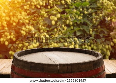 Old oak barrel on a wooden table. Behind blurred dark background. High quality photo