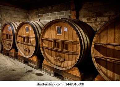 Old Oak Casks In A Cellar In Calvados