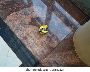 an old object on floor with caution table on it to prevent tripping