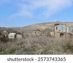 The Old Observations post are surrounded by  brown dried leaves, branches and drought bushes in hills Lebanon