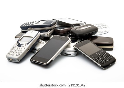 old and obsolete cellphone on white background