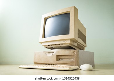 Old And Obsolete Computer Set On The Floor Of Empty Room