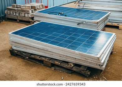 Old obsolete solar panels in factory yard, selective focus