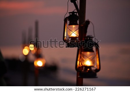 Old oil lanterns on the beach