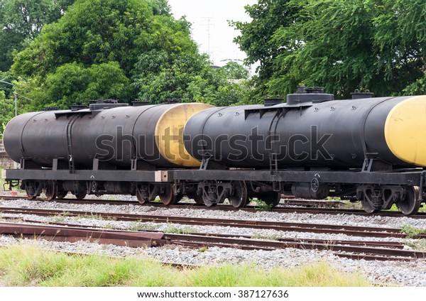 Old oil tank of freight train in the yard of\
large station.