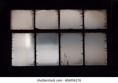 Old Opaque Window In Dark Building