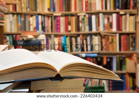 Old open book with library background
