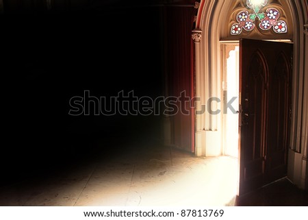 old opened door with light in retro style