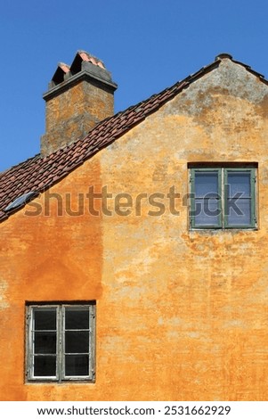 Old orange house of Nyboder district in Copenhagen, Denmark	