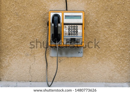 Similar – yellow retro telephone on pink wall, china