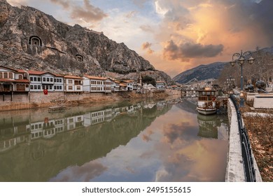 Old Ottoman houses view by the Yesilirmak River in Amasya City. Amasya is popular tourist destination in Turkey.  - Powered by Shutterstock