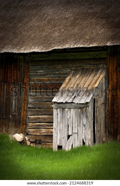 Old Outhouse\
with Rustic Looking Barn\
Vertical