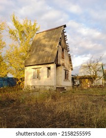 Old Overgrown House In Nature In Spring