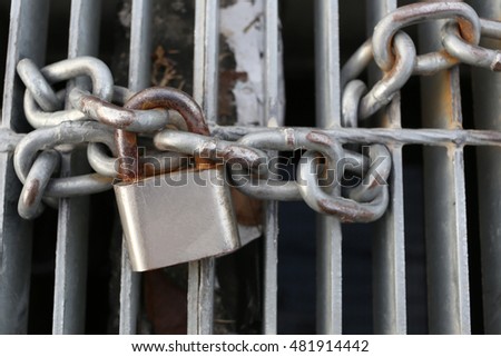old padlock chain lock a safety concept.