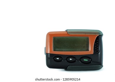 An Old Pager Device Isolated On White Background. Beeper One Way Pager With Orange Case.