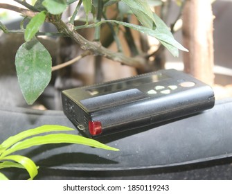 Old Pager Device On Plastic Pot