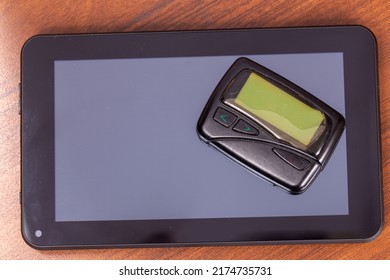 Old Pager And New Tablet Computer