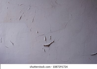 Old paint crack on cement wall, damaged and weathered surface
