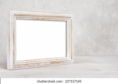 Old Painted Photo Frame On Table Over Abstract Background