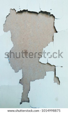 Old painted plastered wall with peeling paint. Abstract brown grunge plastered wall texture and background. Brown-white color. Many layers of paint