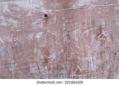 Old painted wood brown wall texture, textured wooden reddish surface background, dark dry stained board, grunge weathered panel, retro-styled obsolete wood, vintage and rustic, copy space.