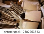 Old paper archives in the warehouse, old documents, folders, forms, cardboard boxes. Archiving of important documents