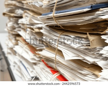 Old paper documents. A stack of papers, files, documents on the shelves of the archive room. Documents in the archive