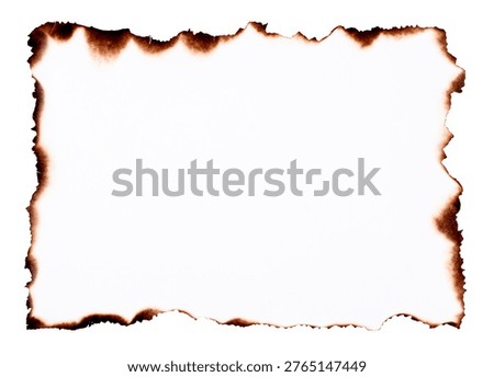Old paper frame with burnt torn edges and scorched marks forming a distressed vintage border, isolated on white background with clipping path.