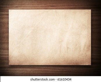 Old Paper On Wood Background