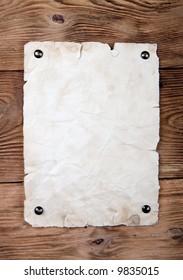 Old Paper Tacked To A Wood Wall