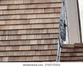 Old Patterned roofing shingles forming textured residential roof surface