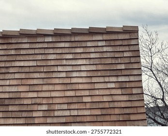 Old Patterned roofing shingles forming textured residential roof surface