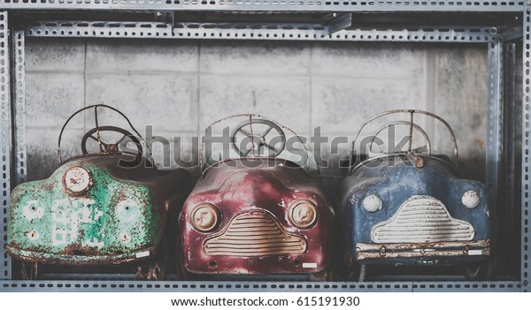 Old pedal cars for kid, nostalgia for a time\
which has passed, vintage\
background