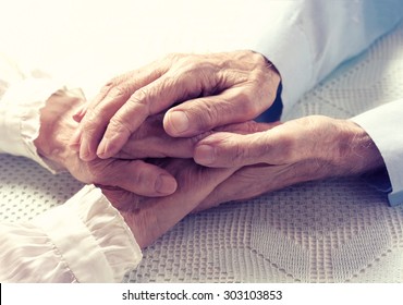Old people couple holding hands closeup. Happy family. 