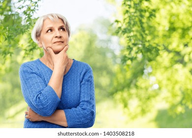 Old People And Decision Making Concept - Portrait Of Senior Woman In Blue Sweater Thinking Over Grey Background