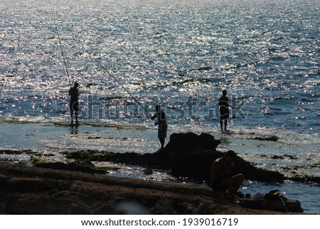 old people fishing at the Beirut coastline in Lebanon