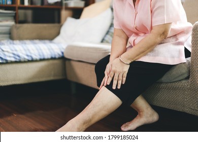 Old People Stay Alone At Home Has Injury Concept. Asian Elderly Woman Has Knee Osteoarthritis Pain.