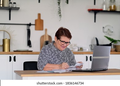 Old People, Tax Return And Home Banking. Worried Senior Lady Paying Federal Taxes, Doing Family Budget. Elderly Hispanic Person And Stress. Concept Of Money, Finance, Financial Problems