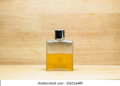 old perfume on wooden texture