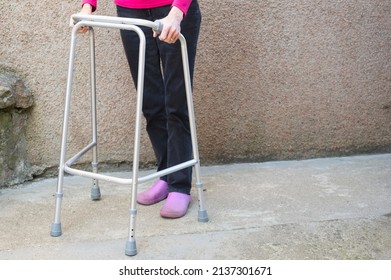 Old Person With Walking Frame Inside House